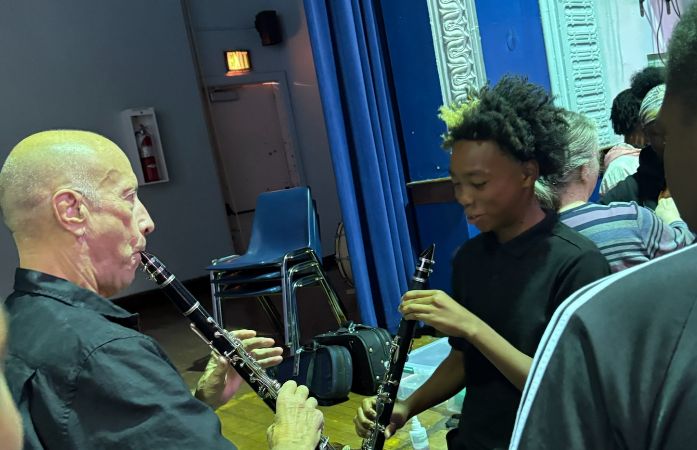  two people with clarinets